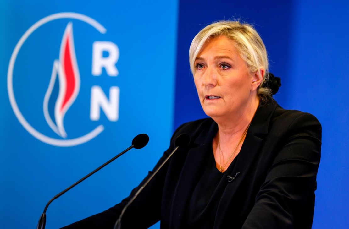 Head of far-right party Rassemblement National Marine Le Pen speaks to the press three days after the beheading of Samuel Paty.