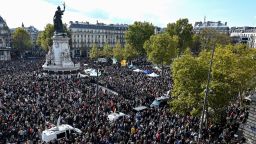 People gather on Place de la Republique in Paris on October 18 in an emotional tribute to Samuel Paty
