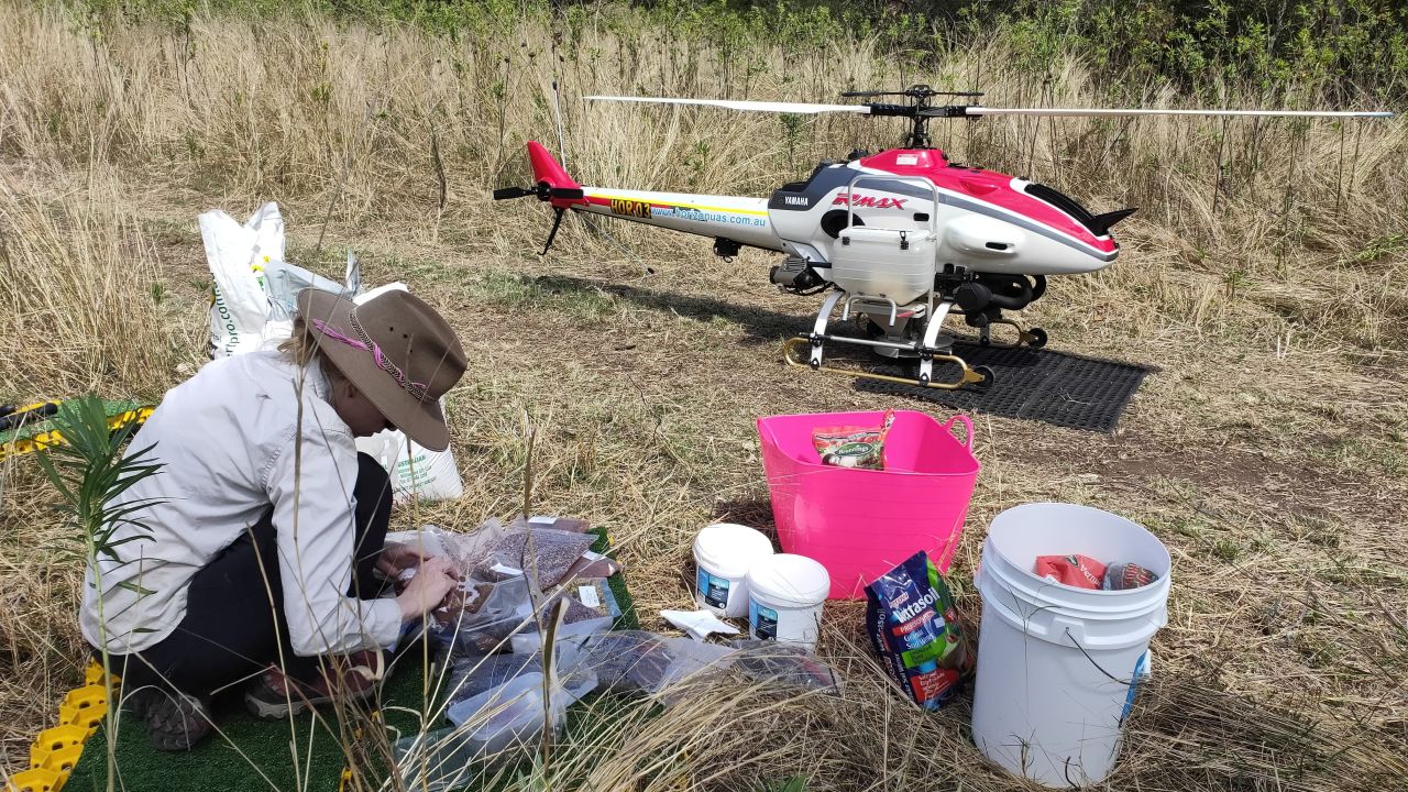 A person prepares to conduct drone seeding to help regenerate Australia's forests in Queensland after the devastating bushfires.