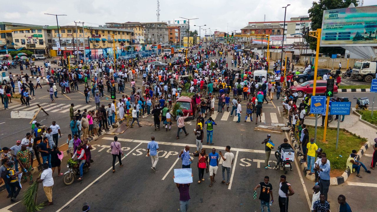 TOPSHOT - Protesters swarm the Allen Avenue roundabout during a demonstration in support of the ongoing protest against the unjust brutality of The Nigerian Police Force Unit, the Special Anti-Robbery Squad (SARS), at Obafemi Awolowo way, Ikeja, Lagos, on October 19, 2020. - Nigerian protesters paralysed Africa's biggest city Lagos on October 19, 2020, blocking the airport as widespread demonstrations sparked by police brutality spiralled. (Photo by Benson Ibeabuchi / AFP) (Photo by BENSON IBEABUCHI/AFP via Getty Images)