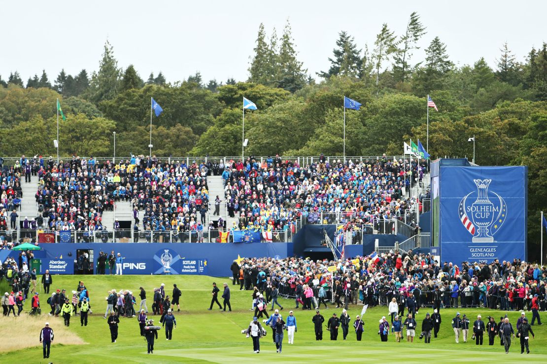 Georgia Hall of Team Europe and Lexi Thompson of Team US walk off the first tee in their match during the final day singles matches of the Solheim Cup at Gleneagles in 2019.