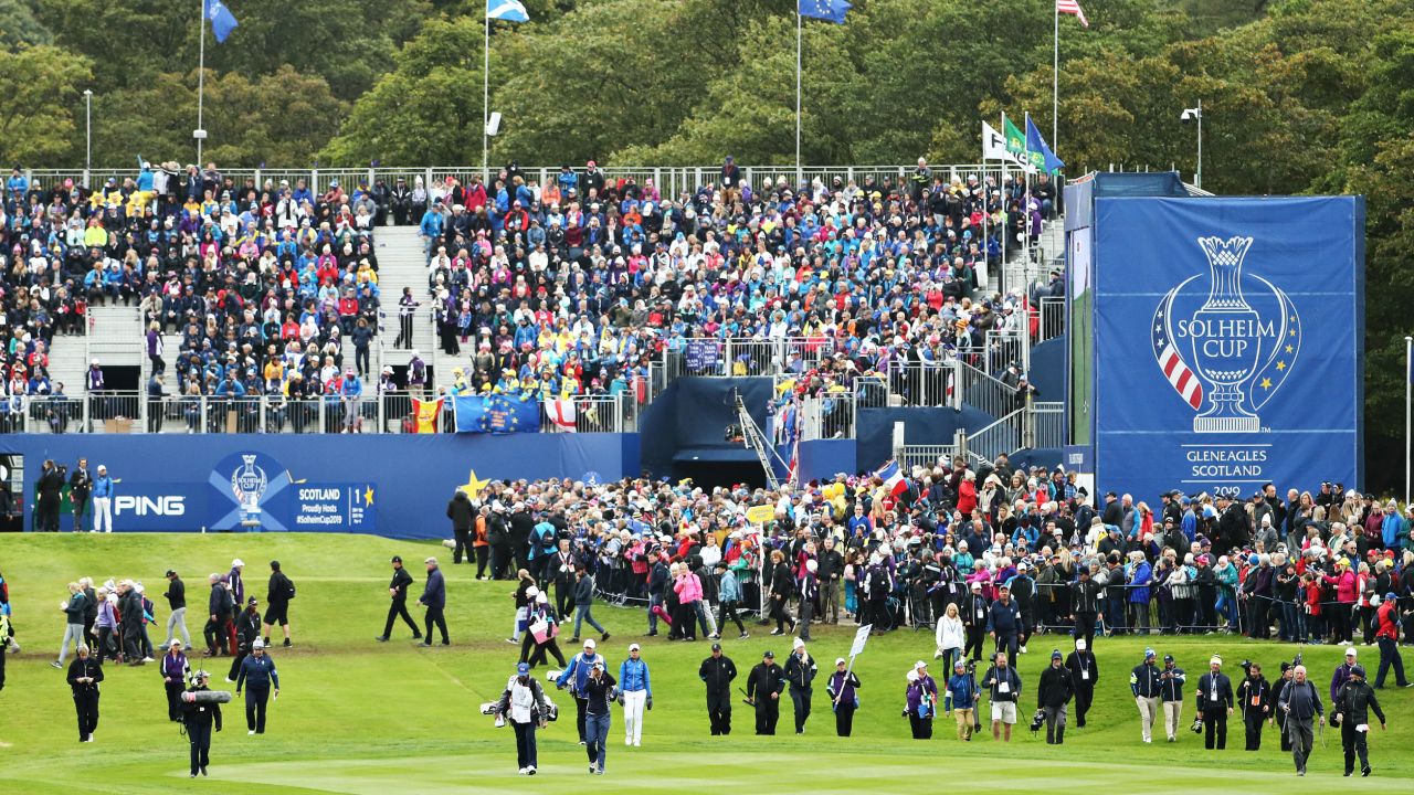 Georgia Hall of Team Europe and Lexi Thompson of Team US walk off the first tee in their match during the final day singles matches of the Solheim Cup at Gleneagles in 2019.