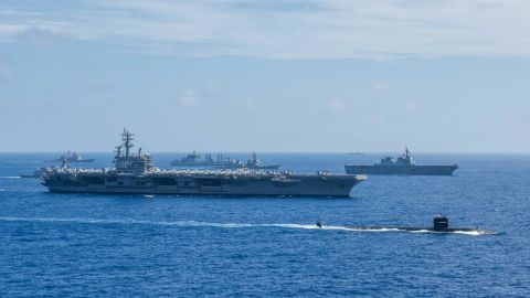 Ships from the Indian Navy, Japan Maritime Self-Defense Force and the US Navy sail in formation during Malabar 2018 in the Philippine Sea.