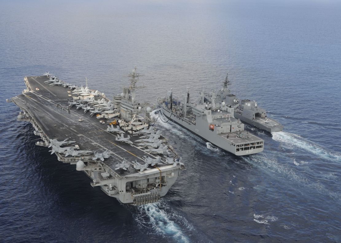 The aircraft carrier USS Theodore Roosevelt  and Japanese Maritime Self-Defense Force Akizuki-class destroyer JS Fuyuzuki sail alongside the Indian Deepak-class fleet tanker INS Shakti during Exercise Malabar 2015. 