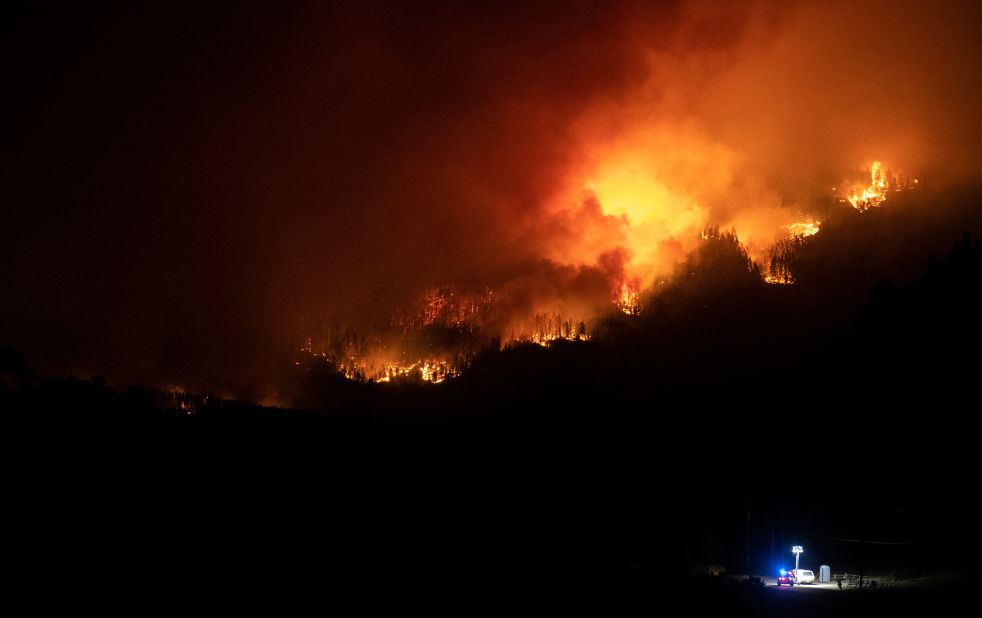 Flames from the Cameron Peak Fire, the largest wildfire in Colorado history, work their way along a ridge outside Estes Park on October 16, 2020.