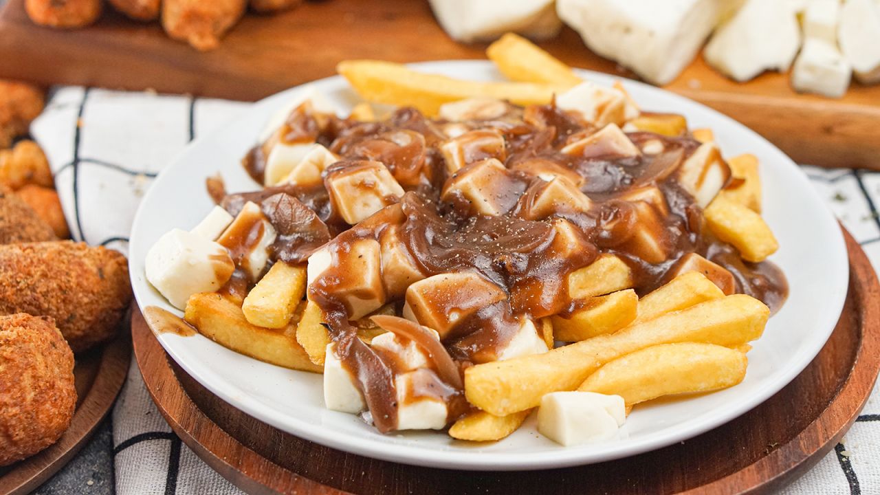 <strong>Poutine, Canada: </strong>Poutine is Quebec slang for "mess," but this is one hot mess we'd can't resist. 