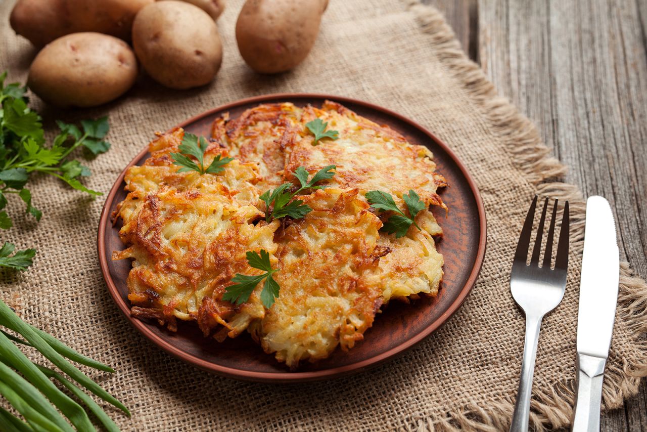 <strong>Latkes, Eastern Europe: </strong>This fried potato pancake, traditionally served with sour cream and applesauce, is best known for its starring role in the traditions of Hanukkah. 
