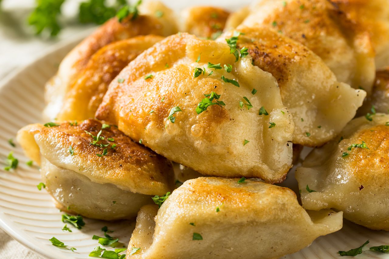 <strong>Potato pierogi, Poland:</strong> Small dumplings that are boiled and then fried, pierogi can be stuffed with almost anything, including sauerkraut, ground meat and fruit. 