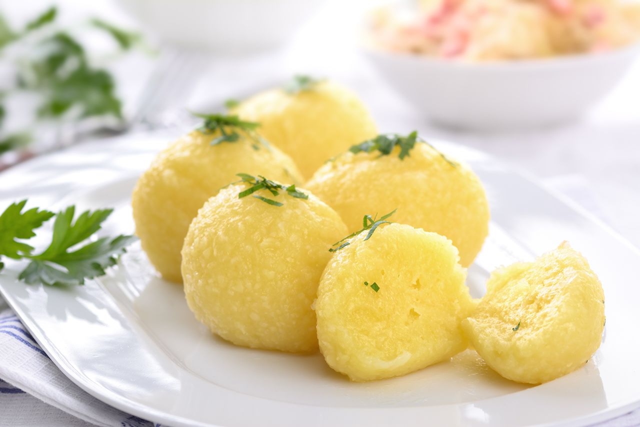 <strong>Kartoffelklösse, Germany:</strong> Boiled and riced potato is shaped into little balls, along with bread cubes, flour, egg and seasonings.