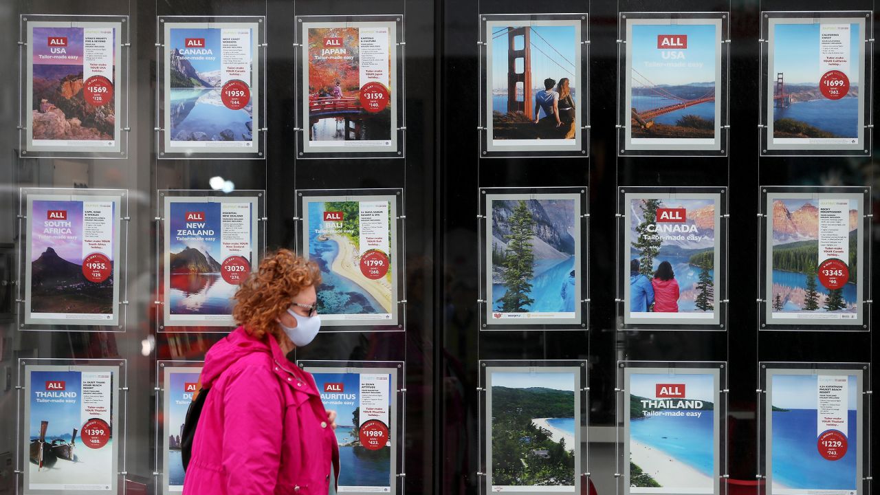 A woman passes the window of a travel agent in Dublin's city centre as the Government continues to recommend that all non-essential overseas travel should be avoided during Phase 3 of the lifting of restrictions. (Photo by Brian Lawless/PA Images via Getty Images)