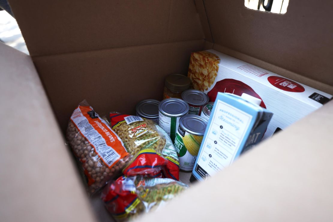 Dry and can foods inside a box during a food giveaway in New York City in early October.