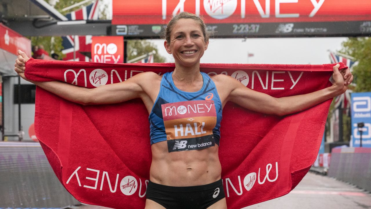 Hall celebrates her performance at the London Marathon finish line. 