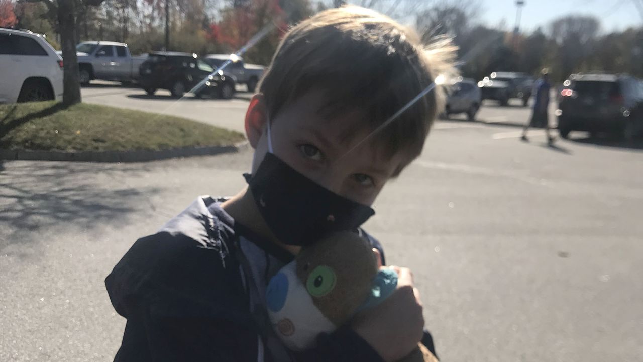 Carter Perry embraces  Stuffy-puppy, a toy he has owned since he was two years old.
