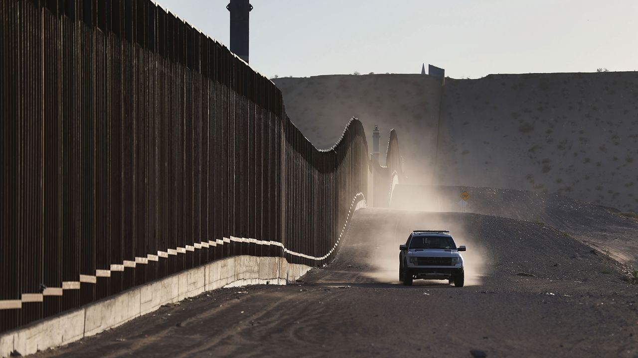 A US Border Patrol vehicle drives along the Mexico border fence on June 24, 2018, in Sunland Park, New Mexico. 