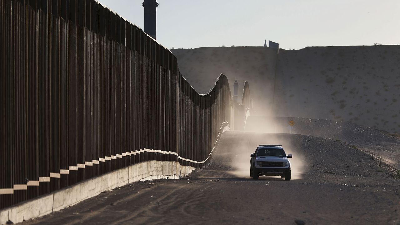 A US Border Patrol vehicle drives along the Mexico border fence on June 24, 2018, in Sunland Park, New Mexico.