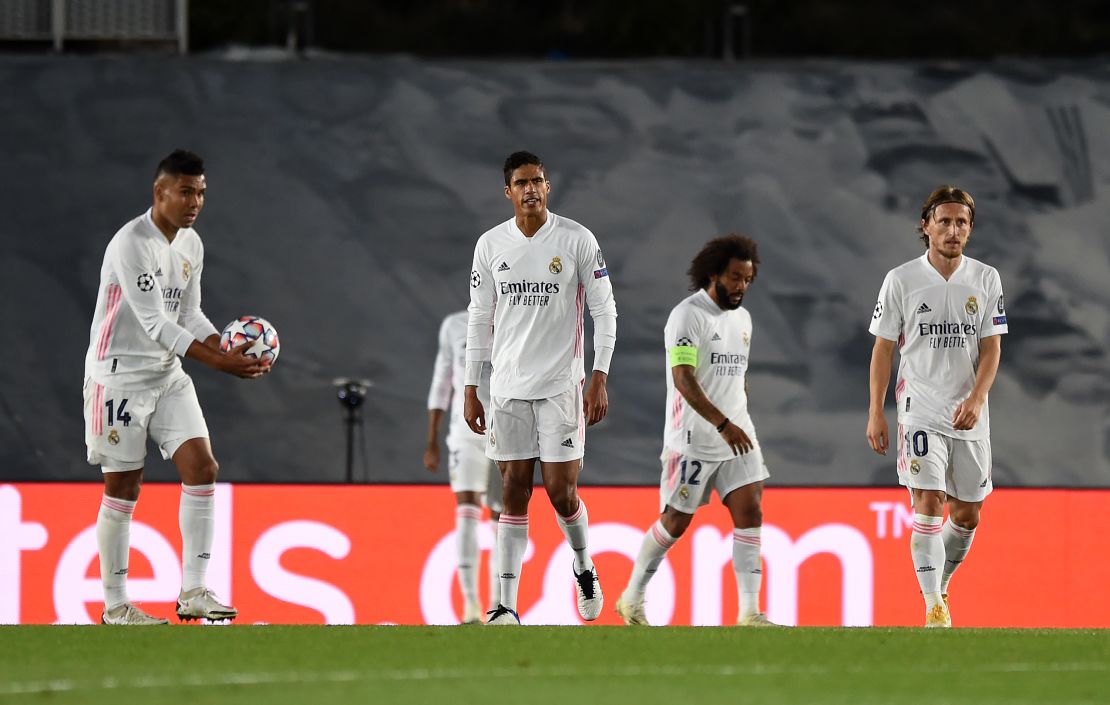 Real Madrid's players look bewildered as Shakhtar scores its third goal.