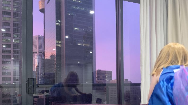 <strong>Looking out: </strong>Manley's daughter takes in the Sydney skyline from the hotel room window.