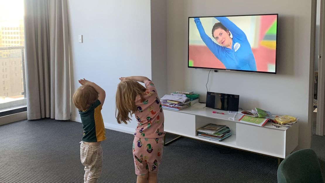 Scout and Japhy watch a video in their Sydney hotel suite.