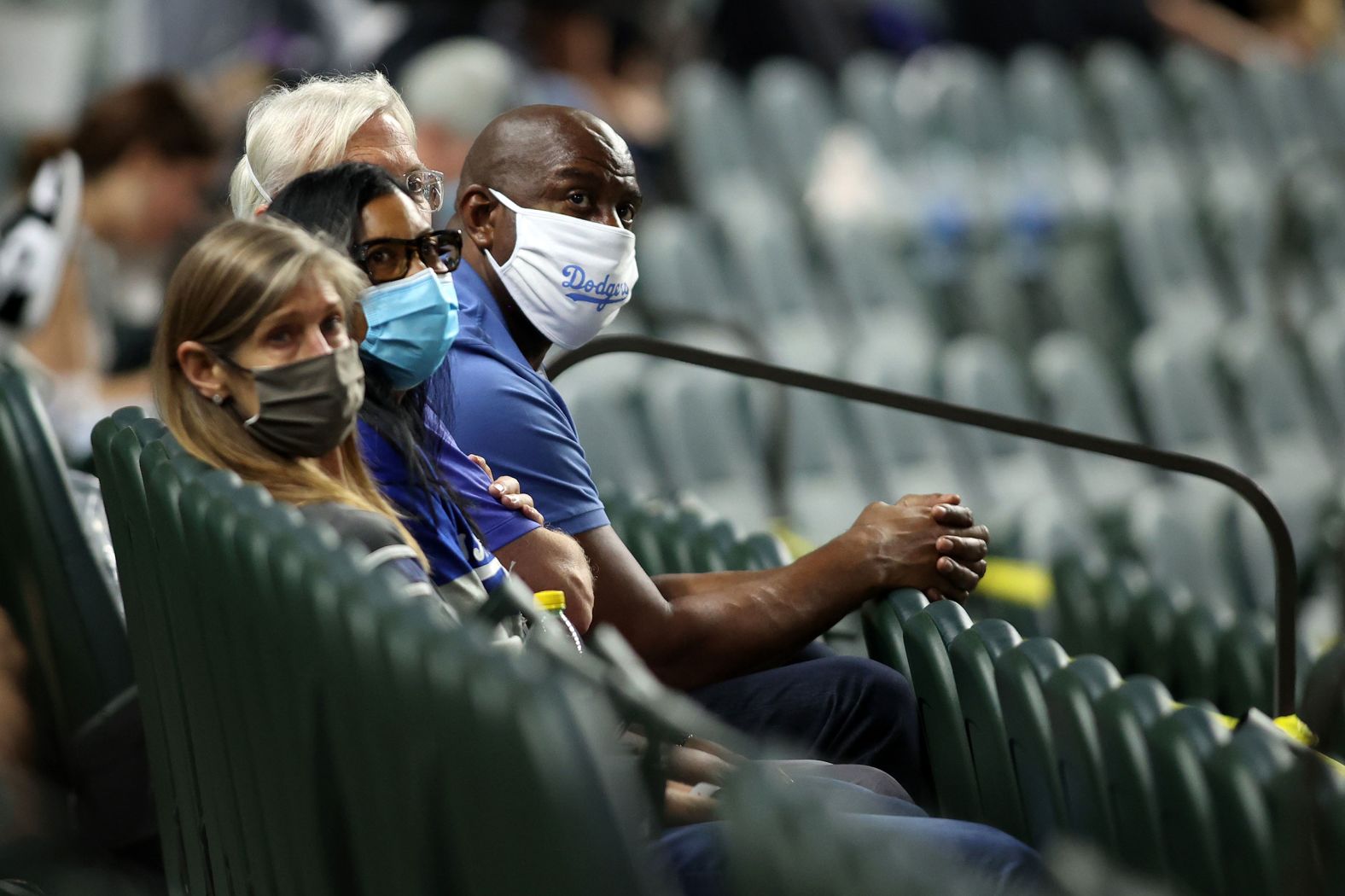 Los Angeles Dodgers co-owner and former NBA player Magic Johnson watches Game 2.