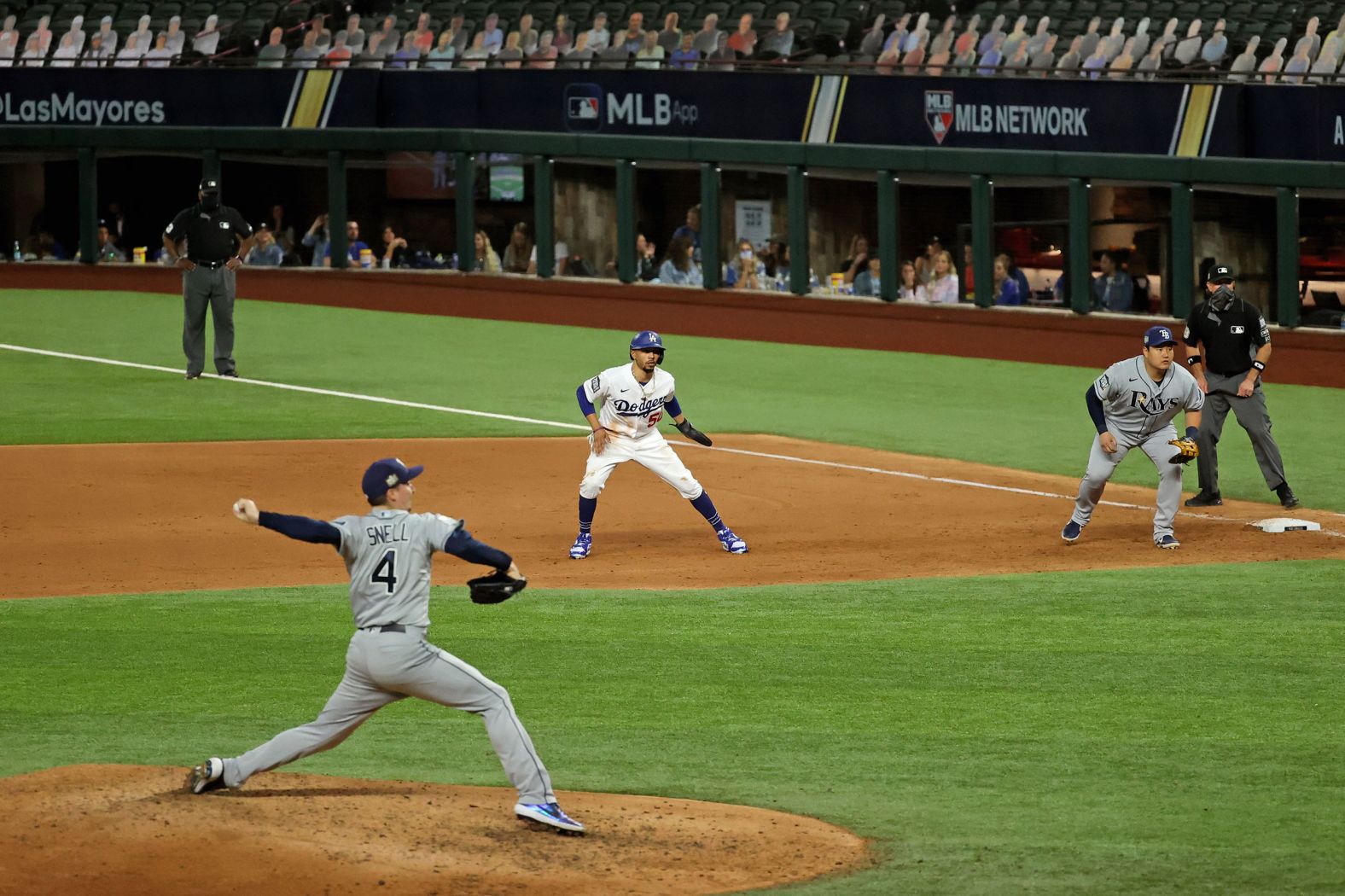 Dodgers right fielder Mookie Betts leads off of first base in the fifth inning.