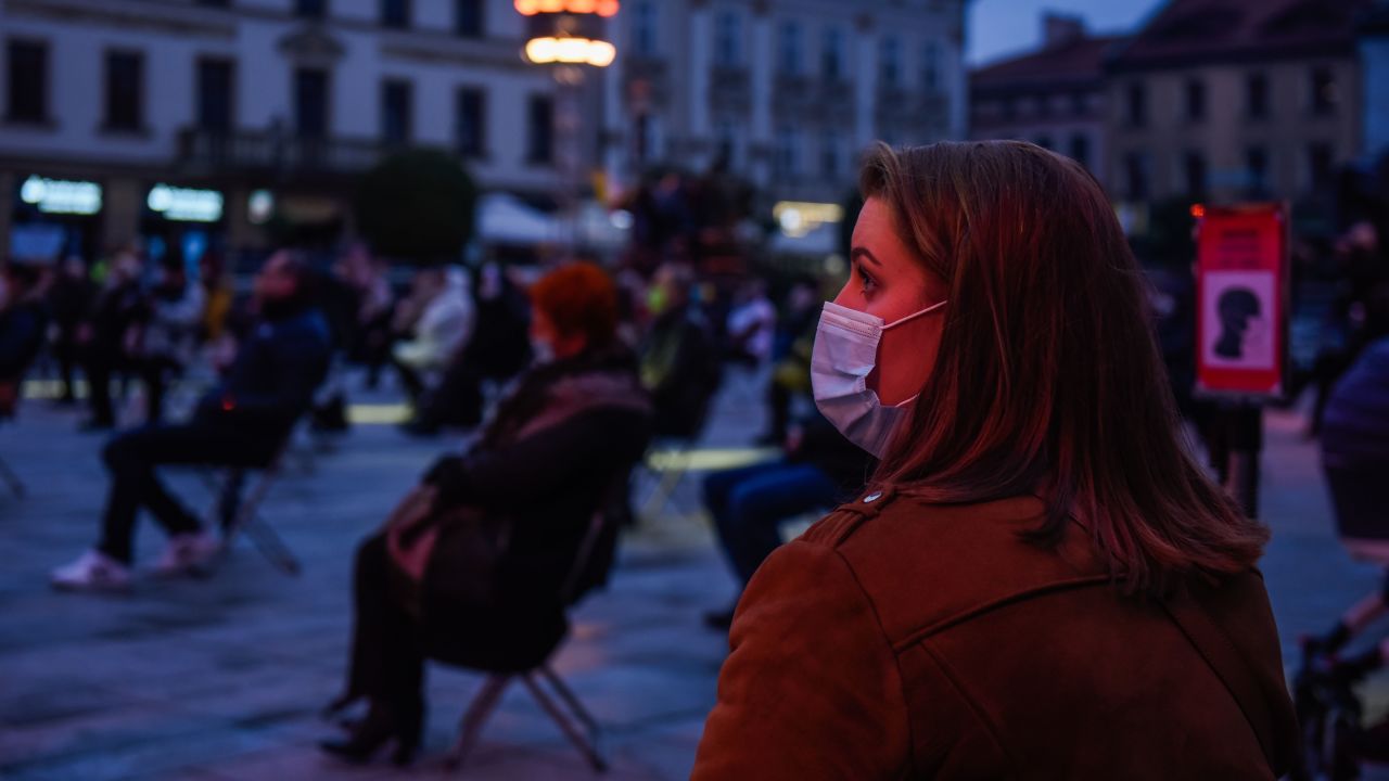 A woman wears a mask during a socially-distanced concert to celebrate the 100th anniversary of the birth of former Pope John Paul II, in Wadowice, Poland on October 18.