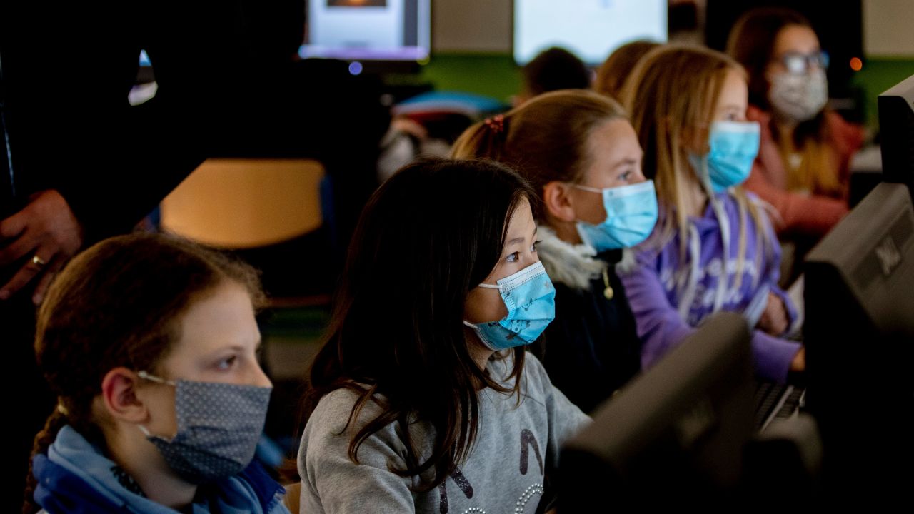 High school students wear face masks as they take part in an electronic learning session in Frankfurt, Germany, on Wednesday.