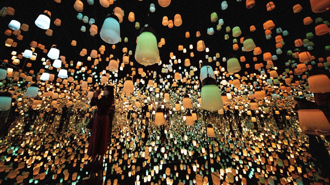 <strong>Tokyo:</strong> In the "Forest of Lamps" digital installation room which forms part of the TeamLab Borderless exhibition at Mori Building Digital Art Museum, hanging lamps light up as visitors approach. Photo taken October 14. 