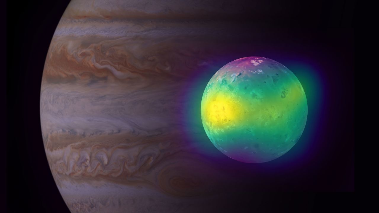 This composite image shows Jupiter's moon Io in a combination of radio and optical light, with a separate image of Jupiter behind it. Data from ALMA show for the first time plumes of sulfur dioxide (in yellow) that rise up from its volcanoes. 