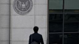 A pedestrian walks near the U.S. Securities and Exchange Commission headquarters in Washington, D.C., U.S., on Thursday, Jan. 2, 2020. The federal appeals court in Manhattan today said the government may pursue insider-trading charges under a newer securities-fraud law not subject to a key requirement of the statute prosecutors traditionally use. Photographer: Andrew Harrer/Bloomberg via Getty Images