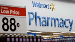 A Wal-Mart Everyday Low Price sign is displayed by the pharmacy during the grand opening of a new Wal-Mart Stores Inc. location in Torrance, California, U.S., on Wednesday, Sept. 12, 2012. The Wal-Mart store, which was the first location to open in Los Angeles County since 2006, was built inside of a former Mervyn's clothing location. Photographer: Patrick Fallon/Bloomberg via Getty Images