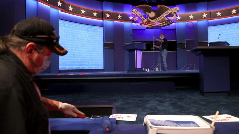 Workers prepare the debate stage on Wednesday, October 21. There was <a href="https://www.cnn.com/politics/live-news/presidential-debate-coverage-fact-check-10-22-20/h_b688ad875a34437c2e2ab8d13e80a468" target="_blank">a last-minute agreement</a> to remove the plexiglass barriers that would've been placed between the candidates.