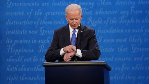 Biden looks at his watch during the debate. It lasted a little over 90 minutes.
