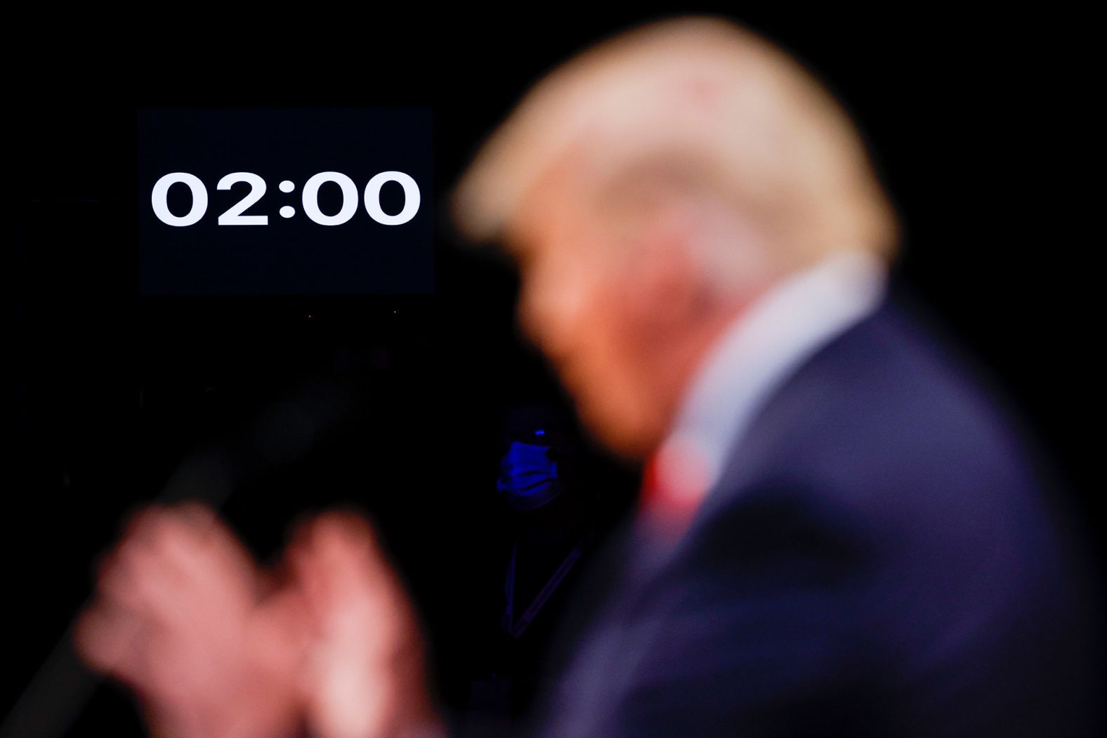 A timer is shown near Trump. Each candidate got two uninterrupted minutes to speak at the start of each debate segment.
