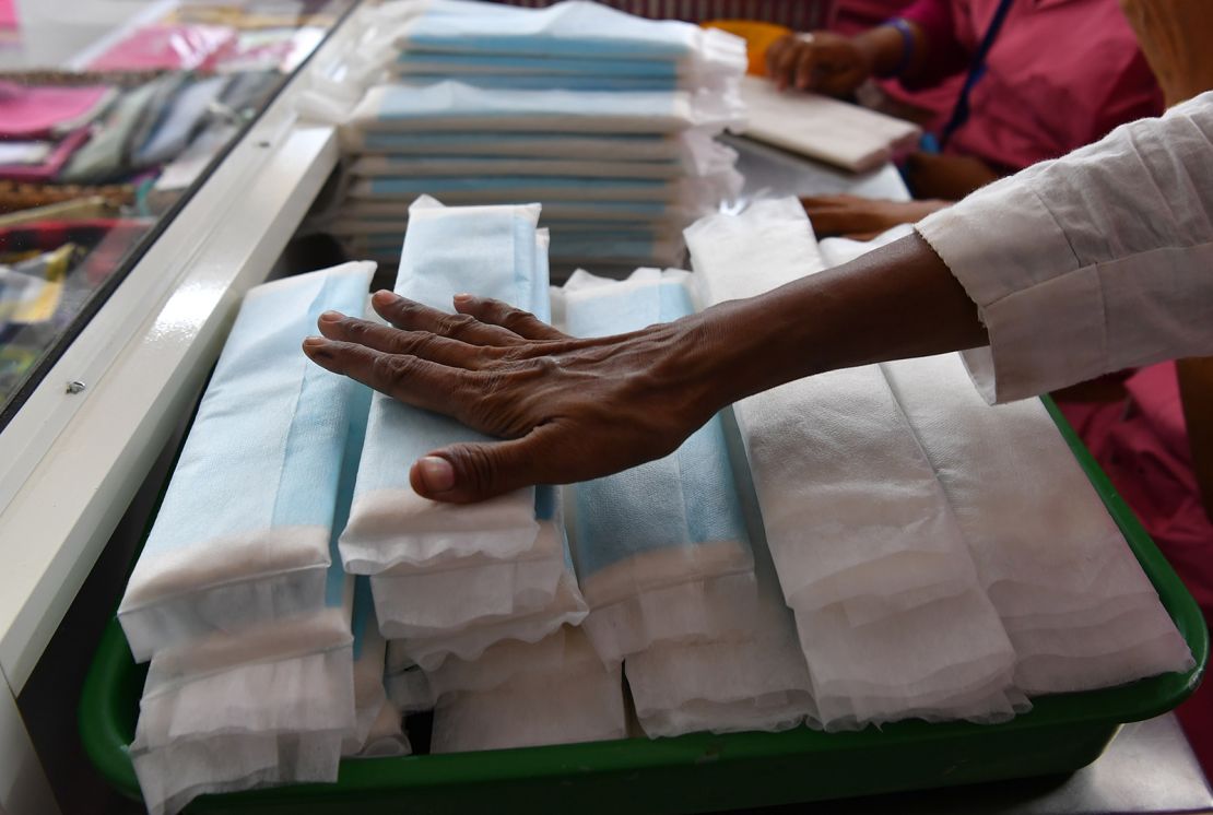 Employees of Myna Mahila Foundation, an Indian charity championing menstrual hygiene, prepare sanitary pads at their office in Mumbai on April 10, 2018. 