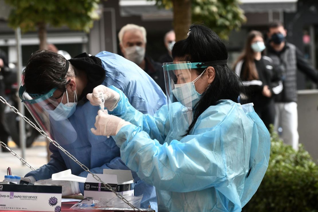 A health worker checks a coronavirus test in Kozani, Greece, on October 16, 2020.