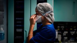 TOPSHOT - A healthcare worker gets ready to attend to a coronavirus patient at the Intensive Care Unit (ICU) of Sao Joao Hospital in Porto on October 22, 2020. (Photo by PATRICIA DE MELO MOREIRA / AFP) (Photo by PATRICIA DE MELO MOREIRA/AFP via Getty Images)