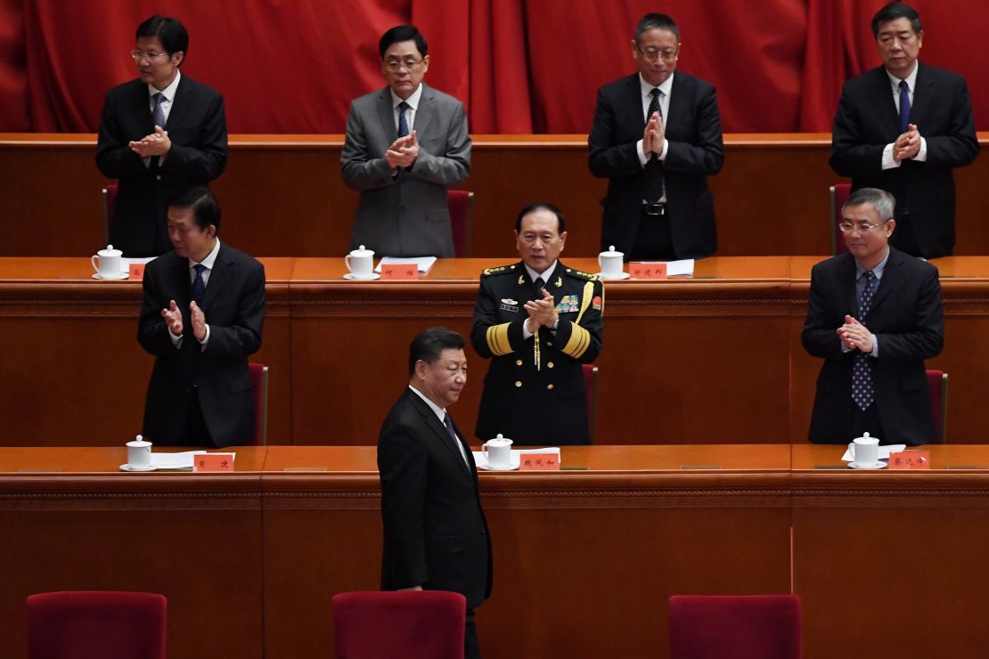 Chinese President Xi Jinping is applauded as he arrives for a ceremony marking the 70th anniversary of China's entry into the Korean War, in Beijing's Great Hall of the People on October 23.