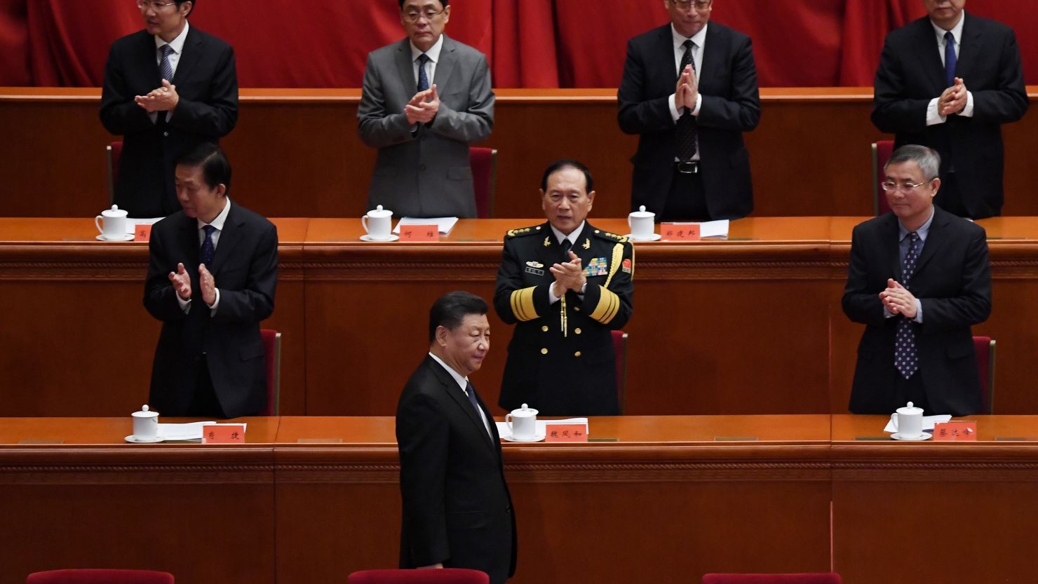 Chinese President Xi Jinping is applauded as he arrives for a ceremony marking the 70th anniversary of China's entry into the Korean War, in Beijing's Great Hall of the People on October 23, 2020.