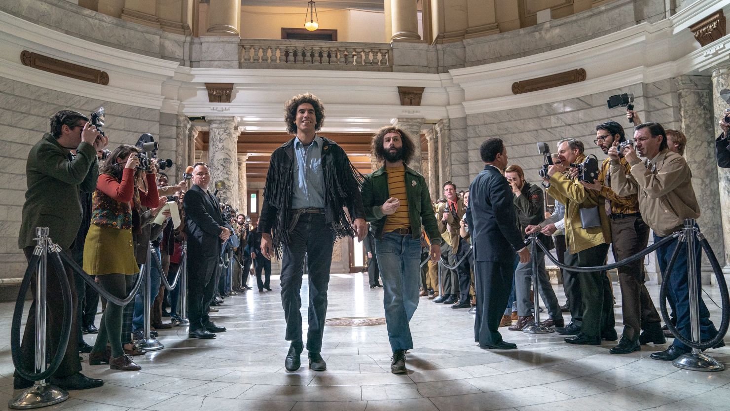 Sacha Baron Cohen as Abbie Hoffman and Jeremy Strong as Jerry Rubin in "The Trial of the Chicago 7." 