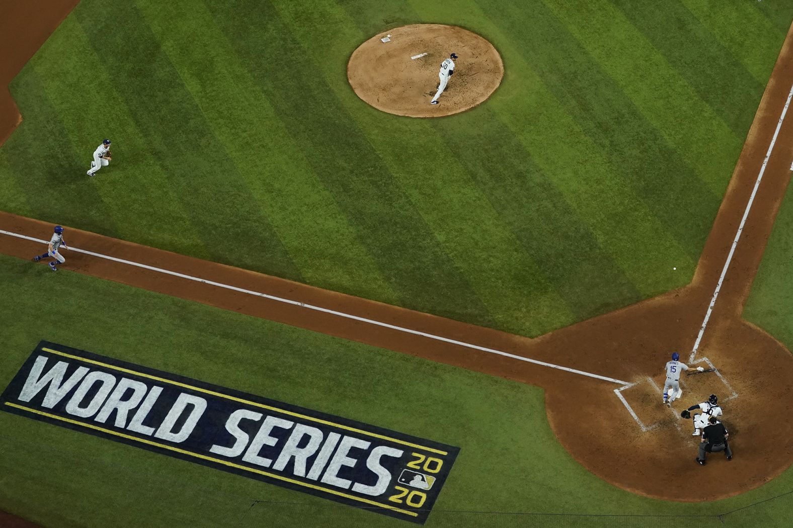 The Dodgers' Austin Barnes lays down a RBI bunt during Game 3's fourth inning.