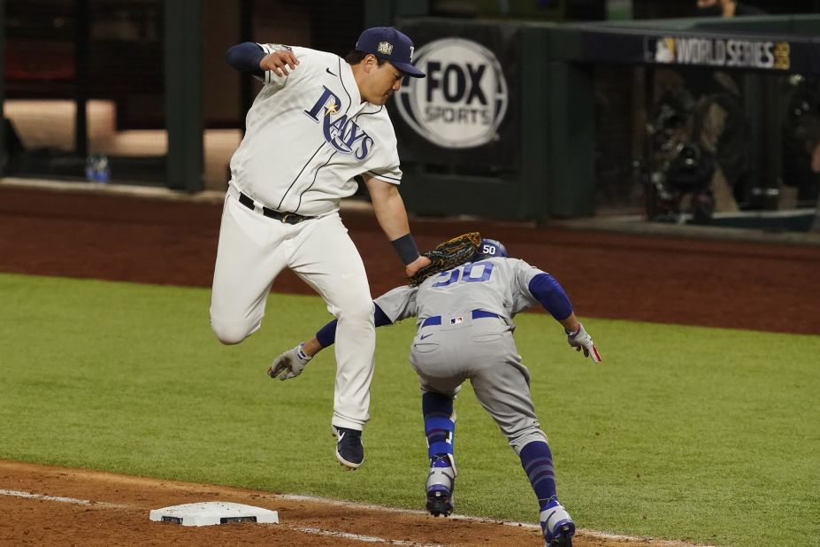 The Dodgers beat the Rays 6-2 in Game 3 on Friday, October 23, taking a 2-1 series lead. Here, Rays' first baseman Ji-Man Choi tags out Mookie Betts at first base during the eighth inning.