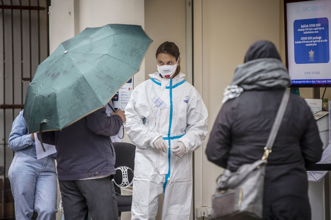 People wait at a testing station on October 10 in Prague, Czech Republic