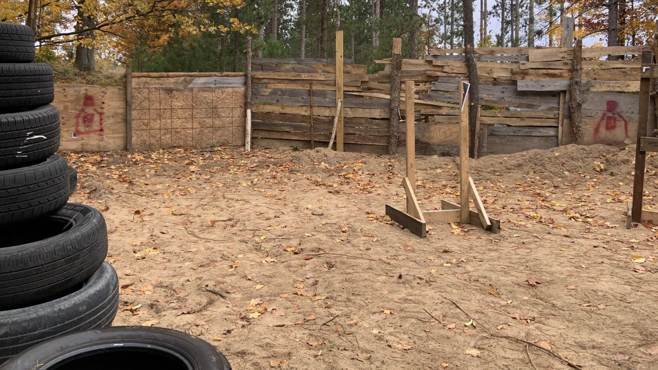 Tires are piled up on the property in Luther where Ty Garbin and others are accused of holding training exercises.