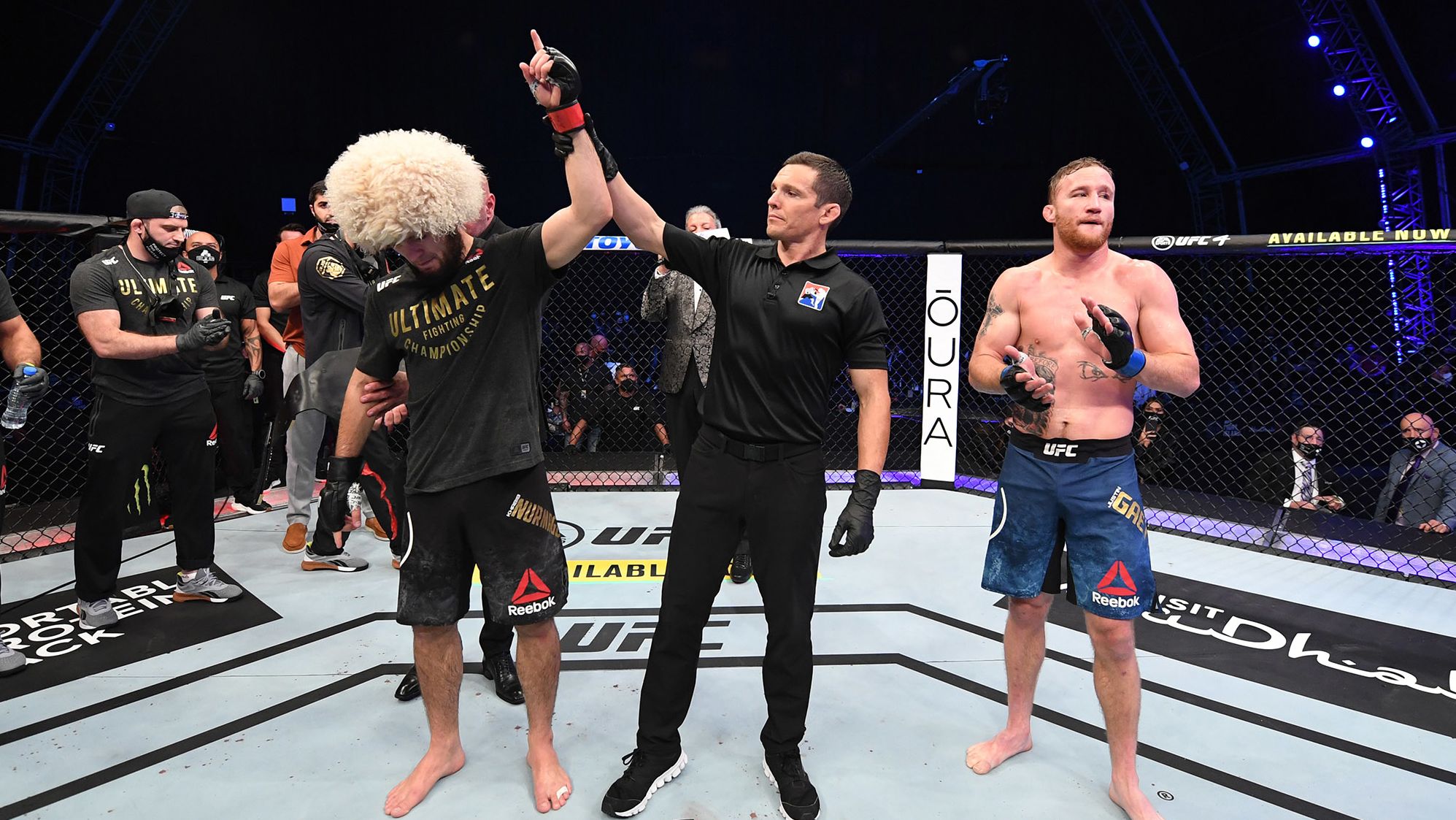 Khabib Nurmagomedov of Russia, left, celebrates his victory over Justin Gaethje in their lightweight title bout on Saturday, October 25, on UFC Fight Island, Abu Dhabi, United Arab Emirates. 