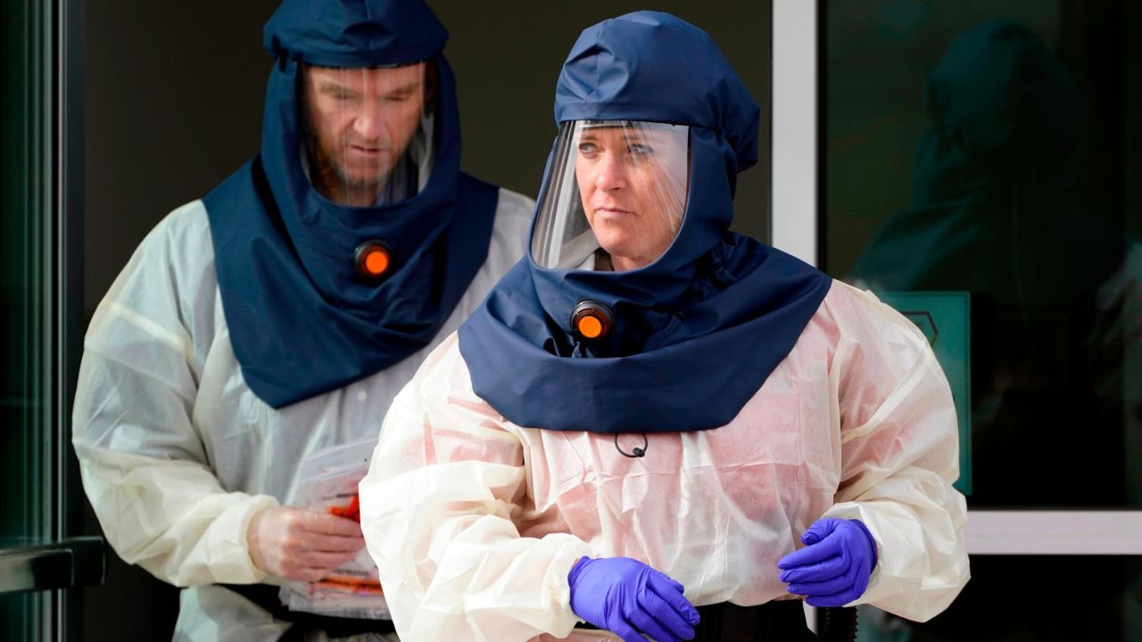 Salt Lake County Health Department public health nurses look on during coronavirus testing outside the Salt Lake County Health Department Friday, Oct. 23, 2020, in Salt Lake City, Utah. (Rick Bowmer/AP)