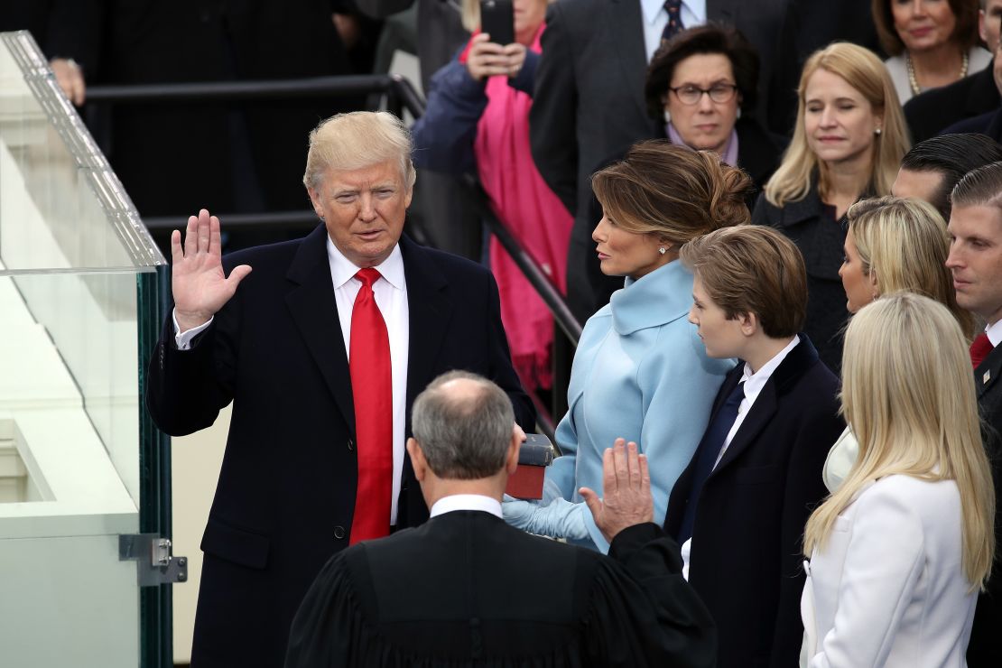 Supreme Court Justice John Roberts (2L) administers the oath of office to U.S. President Donald Trump (L) as his wife Melania Trump holds the Bible on the West Front of the U.S. Capitol on January 20, 2017 in Washington, DC. (Photo by Drew Angerer/Getty Images)