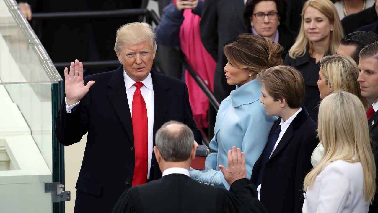Supreme Court Justice John Roberts (2L) administers the oath of office to U.S. President Donald Trump (L) as his wife Melania Trump holds the Bible on the West Front of the U.S. Capitol on January 20, 2017 in Washington, DC. (Photo by Drew Angerer/Getty Images)