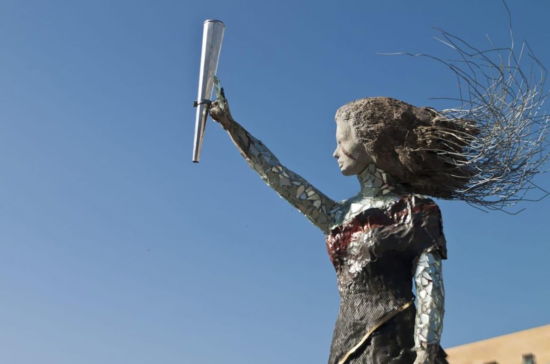 The unnamed scultpure made from explosion debris depicts a woman with long flowing hair.