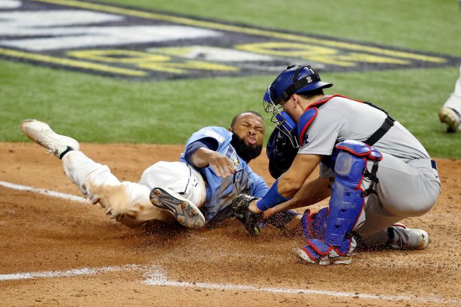 Dodgers catcher Austin Barnes tags out Rays left fielder Manuel Margot trying to steal home during the fourth inning. 