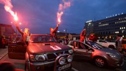Women's rights activists block rush-hour traffic at a major roundabout in Warsaw, Poland on Monday, the fifth day of protests against a ruling to further tighten the country's abortion law.